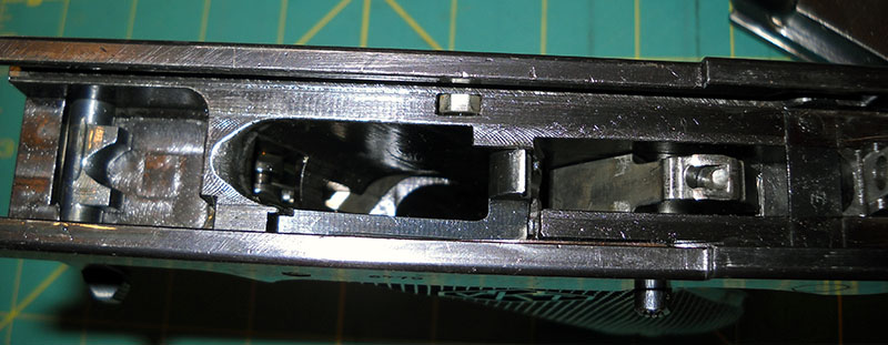 detail, L-35 frame with takedown latch open and hammer cocked